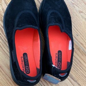 Skechers Black and Orange Go Walk Slip-Ons